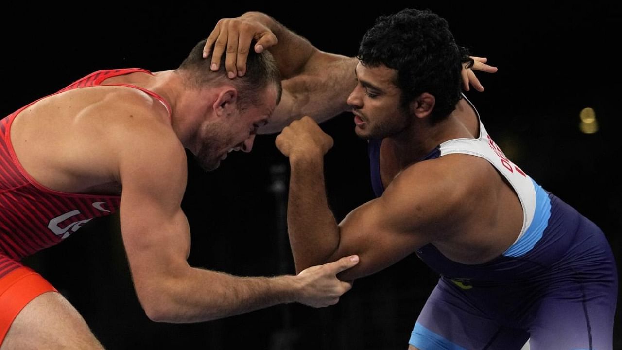  United States' David Morris Taylor III, left, and India's Deepak Punia compete in the men's 86kg Freestyle semifinal wrestling match. Credit: AP Photo