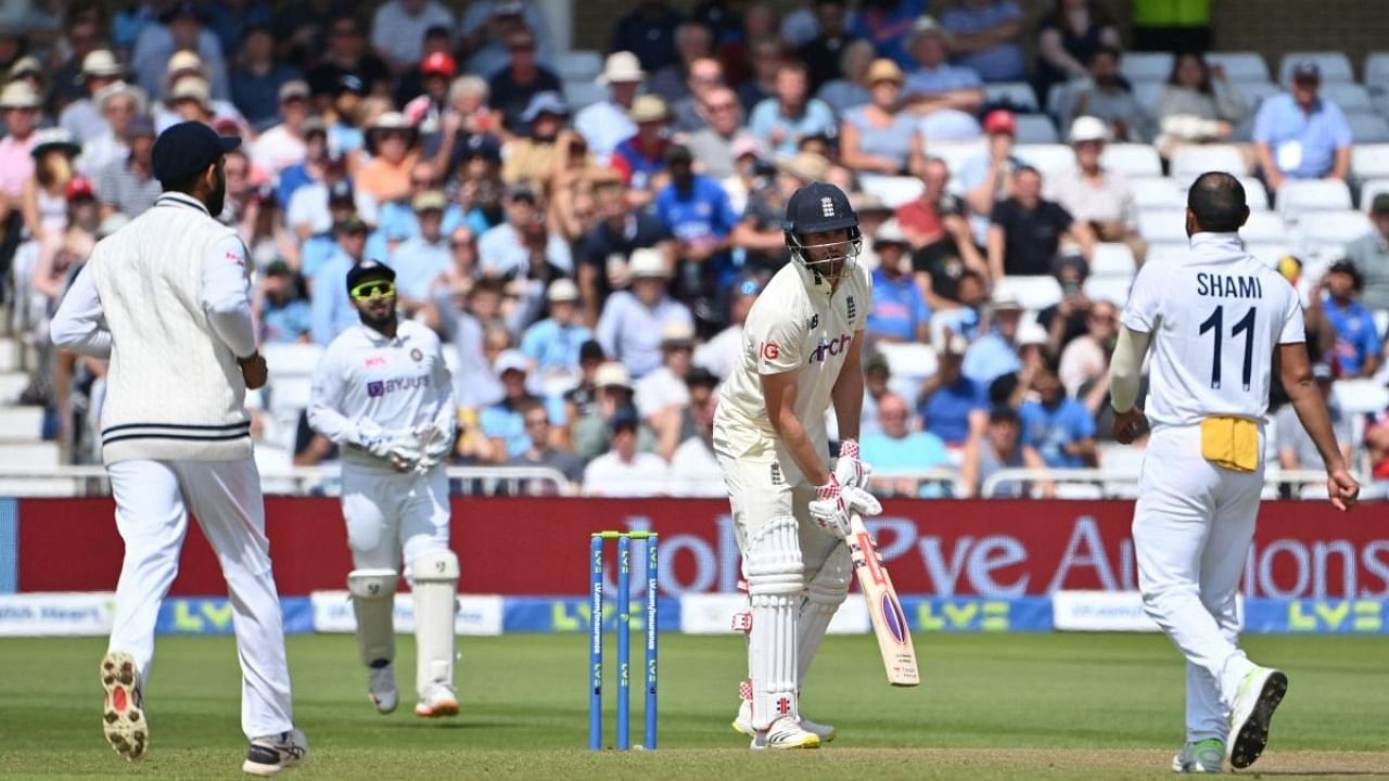 England's Dominic Sibley (C) loses his wicket to India's Mohammed Shami for 18 on the first day of the first Test cricket match of the India Tour of England 2021 between England and India at the Trent Bridge cricket ground in Nottingham, Nottinghamshire. Credit: AFP Photo