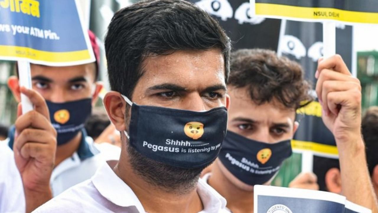 National Students' Union of India (NSUI) activists stage a protest over the Pegasus spyware row, in New Delhi, Monday. Credit: PTI Photo