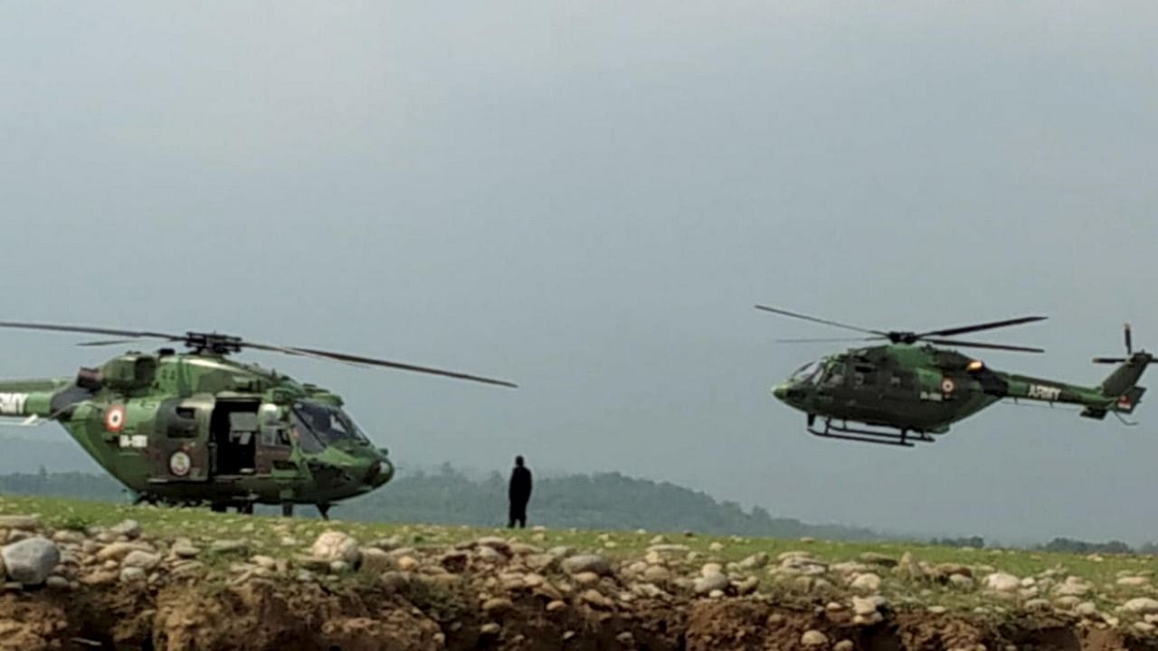 Indian Army helicopters during a search & rescue operation after a helicopter of the Indian Army crashed near Ranjit Sagar Dam Lake in Kathua district. Credit: PTI Photo