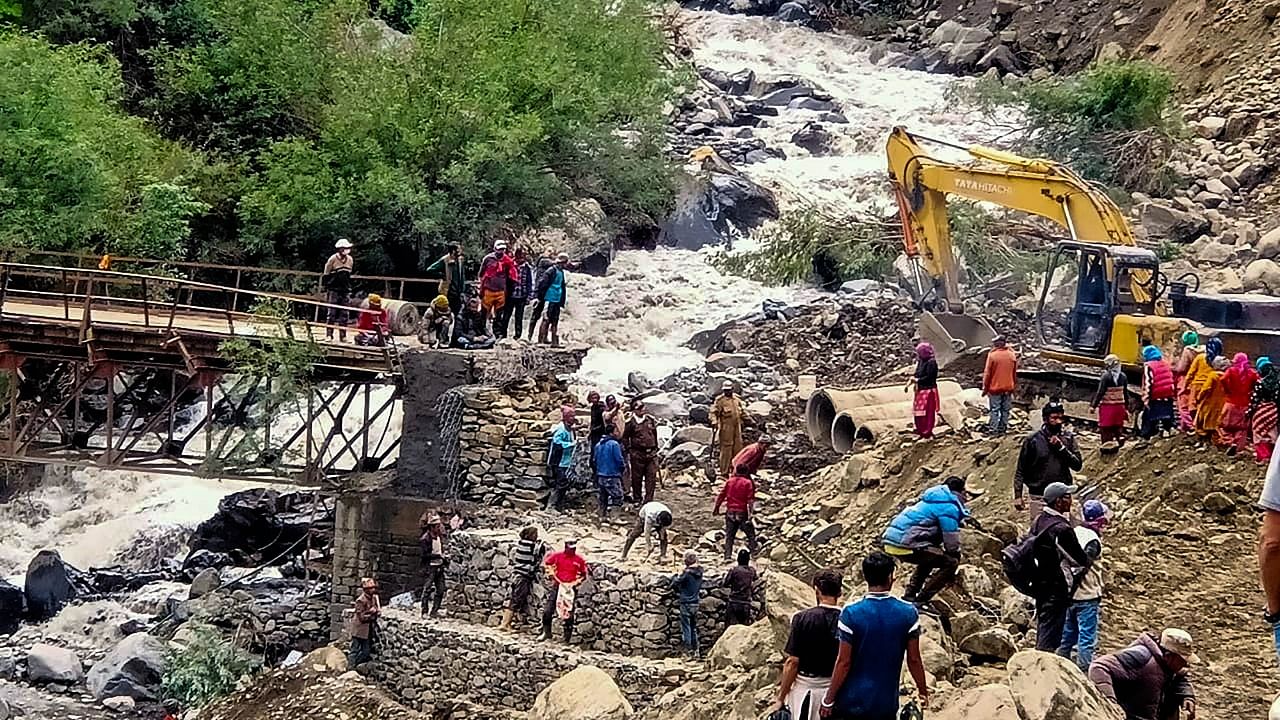 BRO workers restore the bridge over Shansha Nala in Lahaul & Spiti district, Tuesday. Credit: PTI Photo