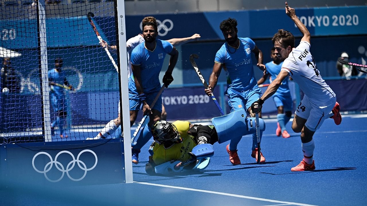 India defeated a plucky Germany 5-4 to claim the bronze. Credit: AFP Photo