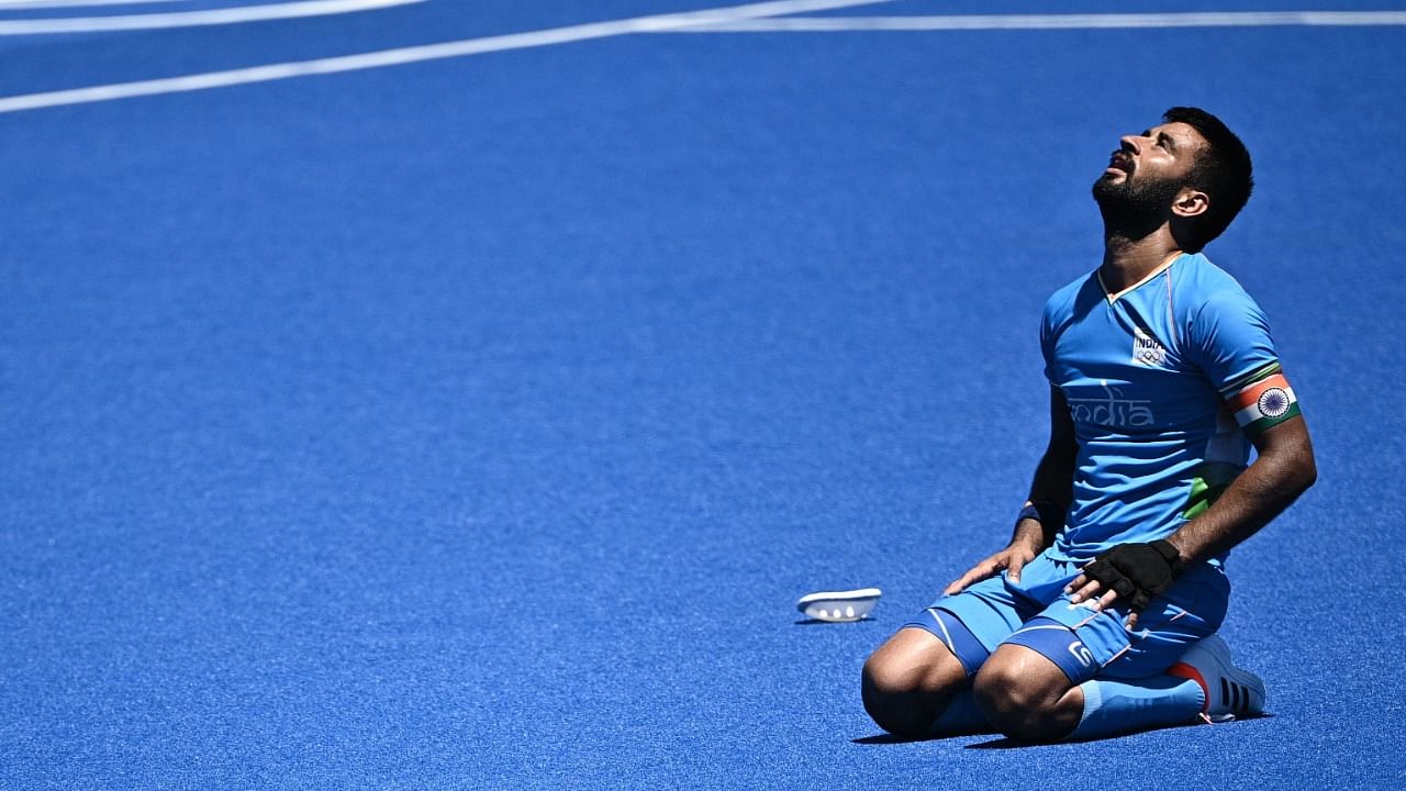 Manpreet Singh reacts after winning the men's bronze medal match. Credit: AFP Photo
