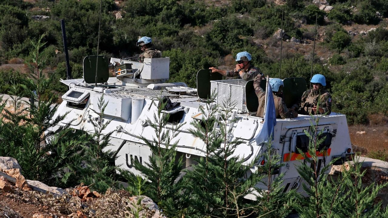 A United Nations Interim Force in Lebanon (UNIFIL) convoy patrols the road between the southern Lebanese towns of Naqura and Shamaa near the border with Israel. Credit: AFP Photo