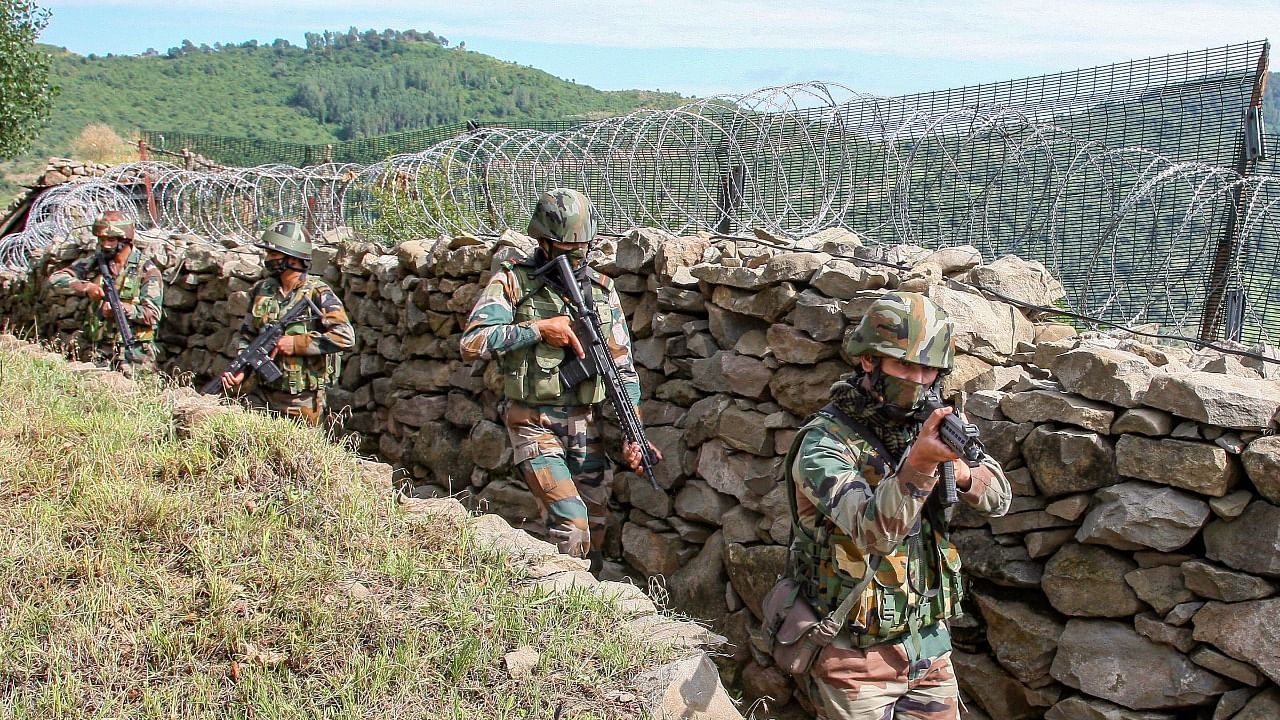 Indian Army soldiers patrol near Line of Control. Credit: PTI File Photo
