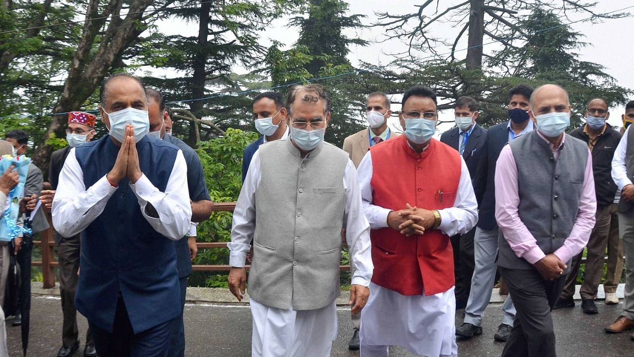 Thakur with others arrive to attend the first day of Monsoon Session of State Assembly. Credit: PTI Photo