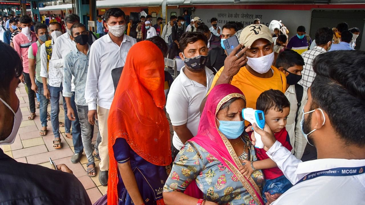 Passengers undergo thermal scanning following Covid-19 protocols at a Dadar railway station, in Mumbai, Wednesday, Aug. 4, 2021. Credit: PTI Photo