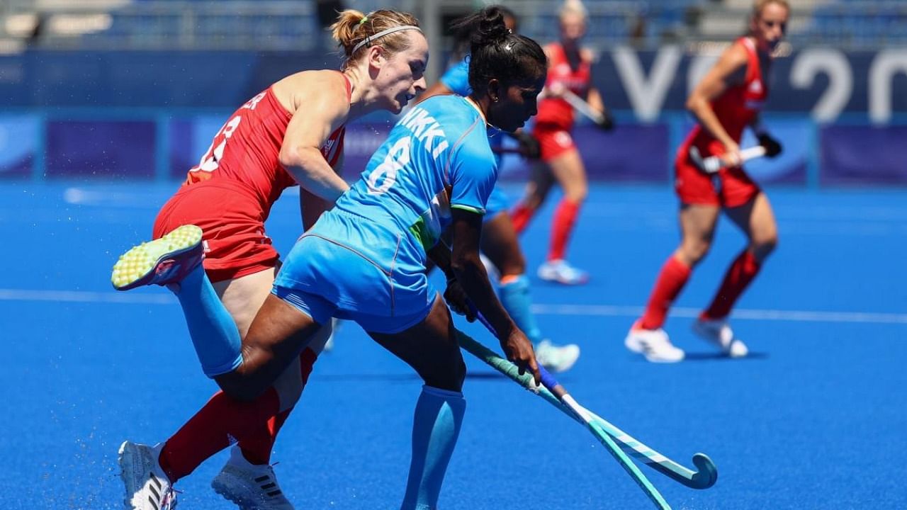 Elena Rayer of Britain in action against Nikki Pradhan of India. Credit: Reuters Photo