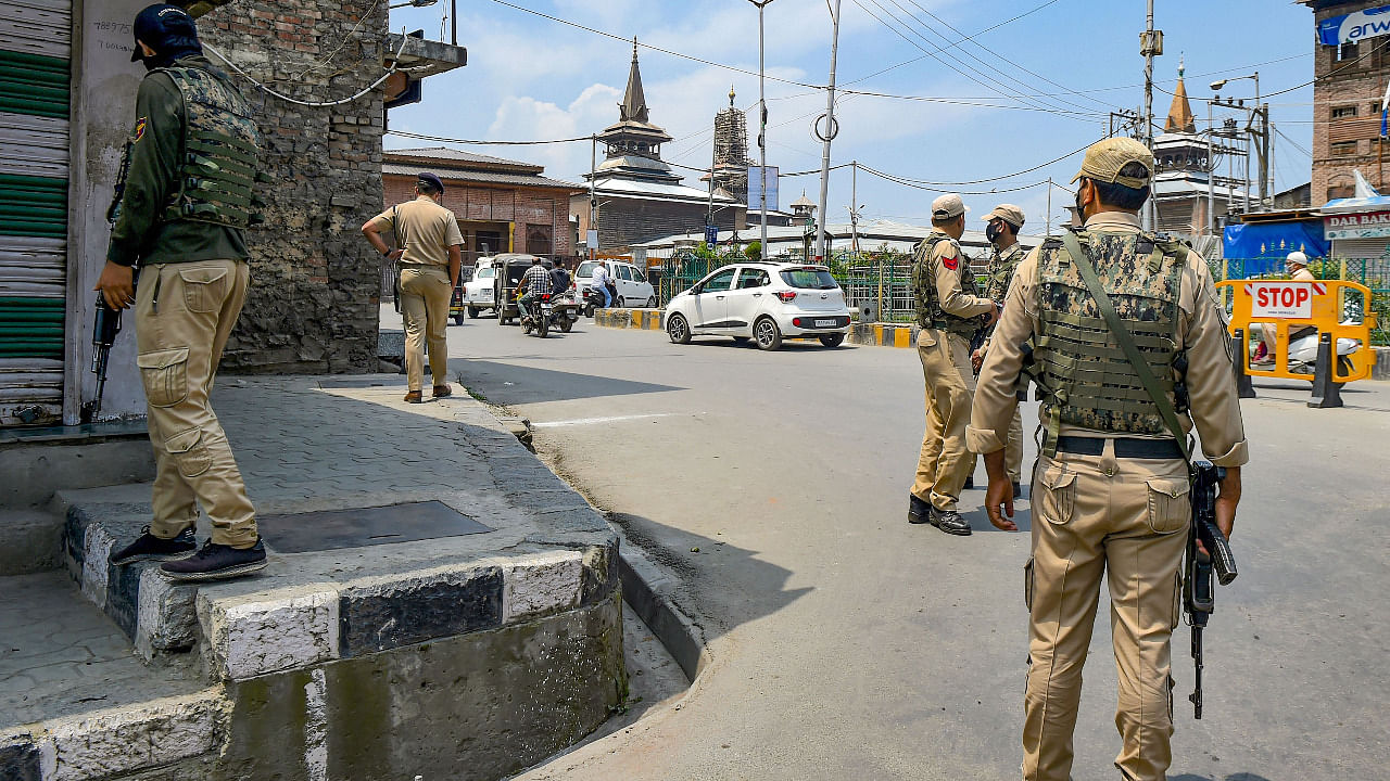 Security personnel stand guard near the site after an explosion at Nowhatta in downtown Srinagar. Credit: PTI Photo