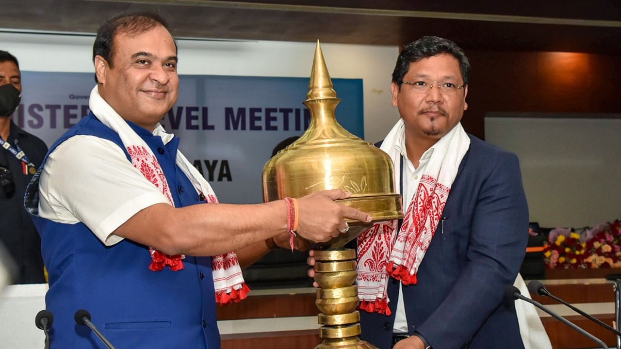 Meghalaya Chief Minister Conrad Sangma being feliciated by Assam Chief Minister Himanta Biswa Sarma at a meeting on Assam-Meghalaya border, in Guwahati. Credit: PTI Photo