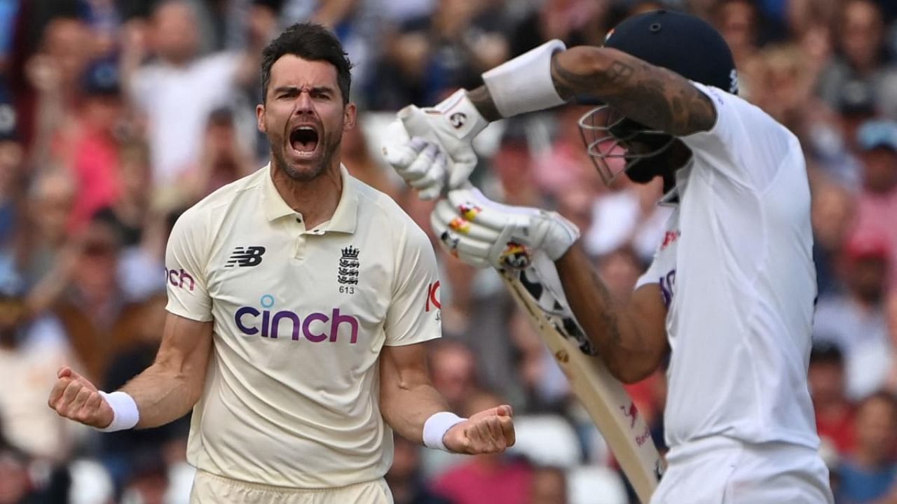 England's James Anderson (L) celebrates taking the wicket of India's KL Rahul for 84 on the third day of the first cricket Test match of the India Tour of England 2021 between England and India at the Trent Bridge cricket ground in Nottingham, central England, on August 6, 2021. Credit: AFP Photo