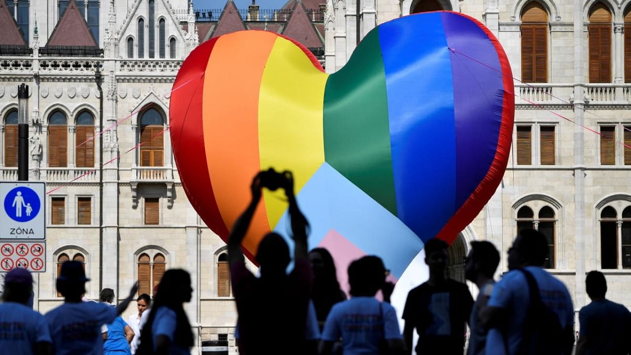NGOs put up a huge rainbow balloon at Hungary's parliament protesting against anti-LGBT law in Budapest. Credit: Reuters Photo