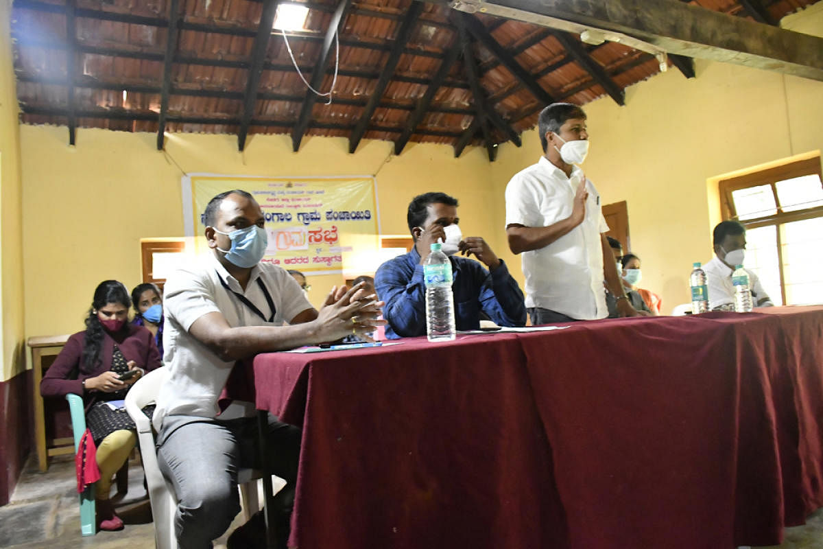 Nakoor Shirangala Gram Panchayat president B G Ramesh speaks during the first Gram Sabha held at the Government Higher Primary School hall in Kanbail.