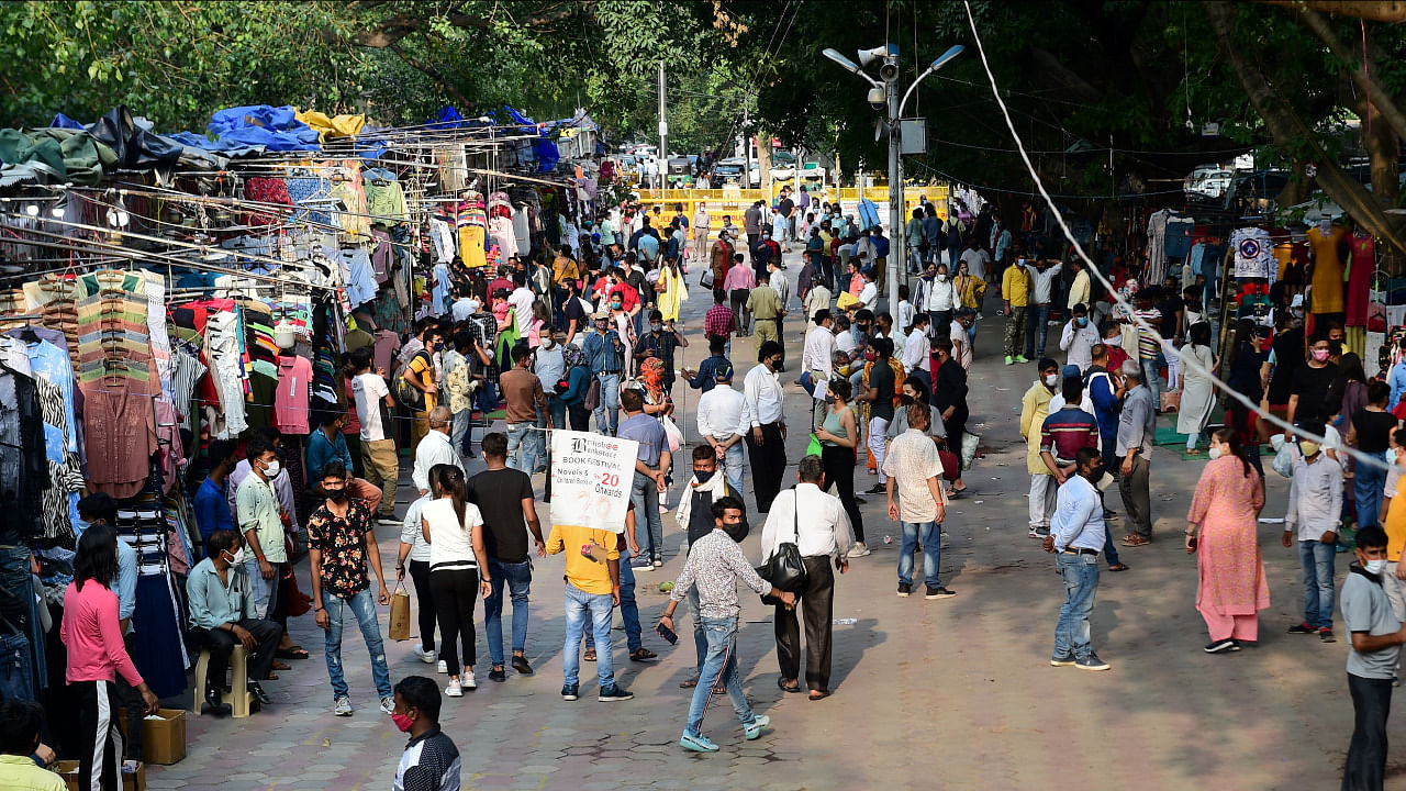 People crowd at Janpath market during Covid-19 lockdown relaxation, in New Delhi. Credit: PTI File Photo