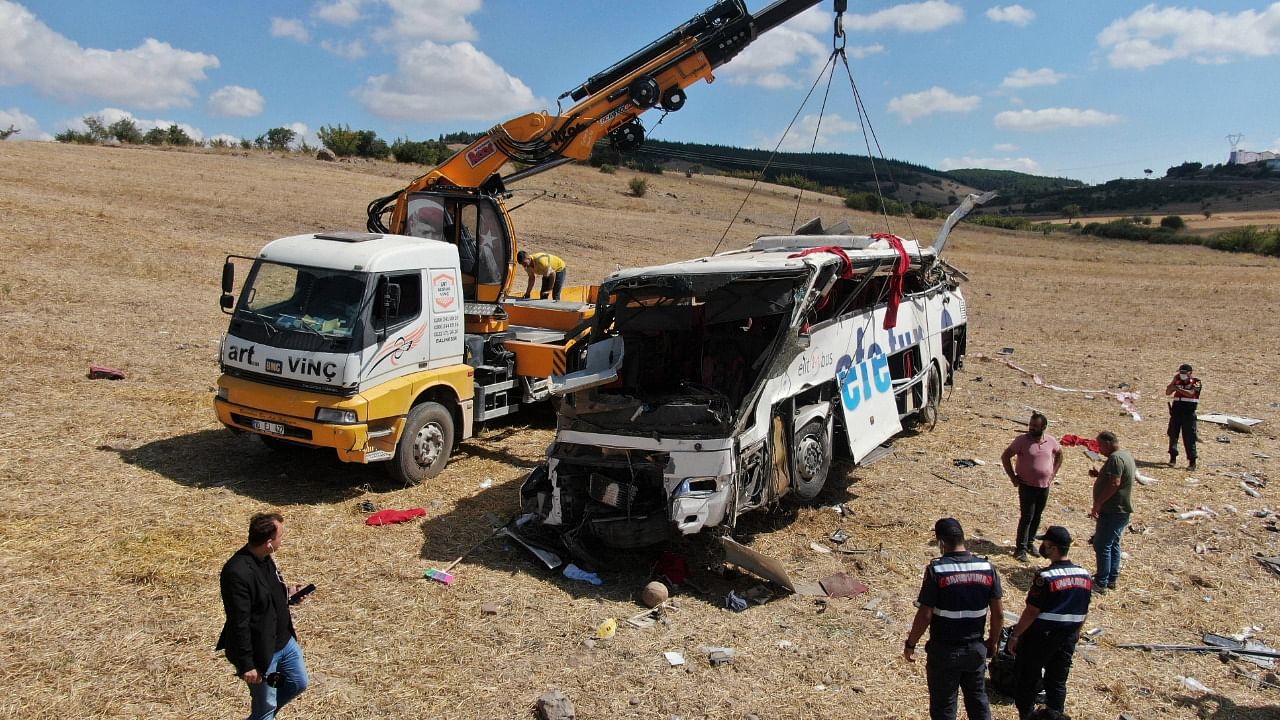 Officials investigate at the site of a bus crash, in Balikesir, western Turkey. Credit: AP Photo