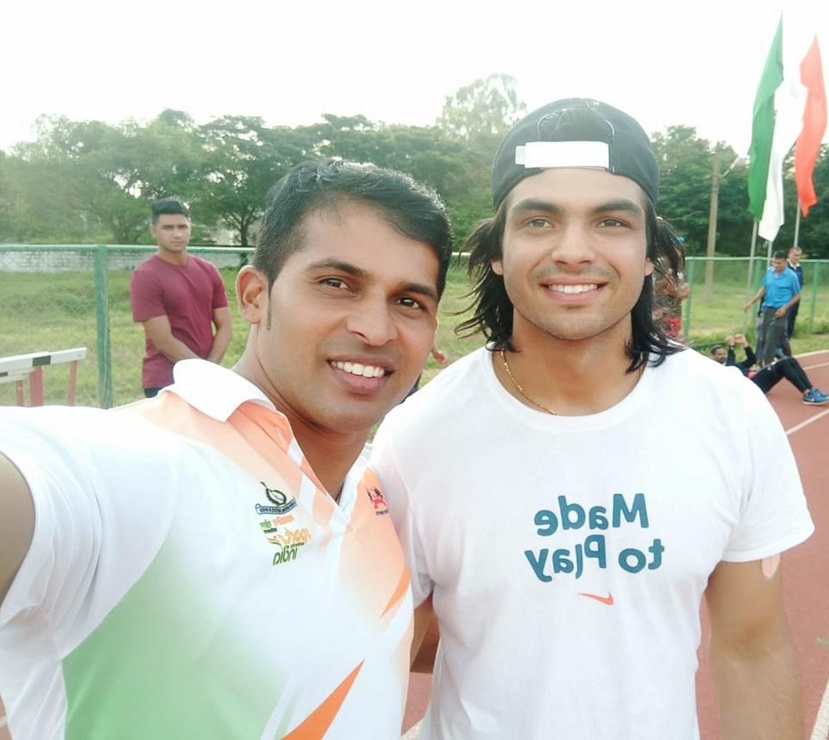 Coach Kashinath Naik takes a selfie with Neeraj Chopra during the latter’s training stint at Indian Army sports facility at Patiala. Credit: DH File Photo