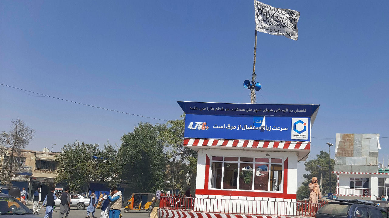 A Taliban flag flies in the main square of Kunduz city after fighting between Taliban and Afghan security forces, in Kunduz. Credit: AP Photo