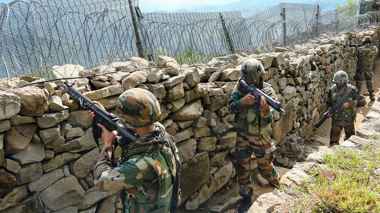 Indian army soldiers patrol along the Line of Control (LOC) between India and Pakistan border in Poonch district. Credit: PTI File Photo