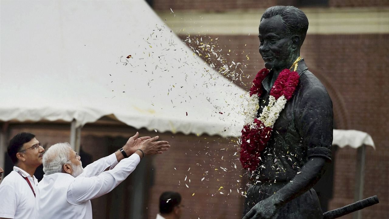 Modi pays floral tribute to Major Dhyan Chand. Credit: PTI Photo