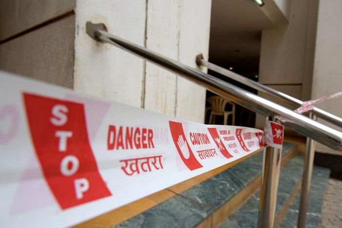 An apartment block sealed down due to Covid cases in Mahalakshmi Layout. Credit: DH File Photo/Pushkar V