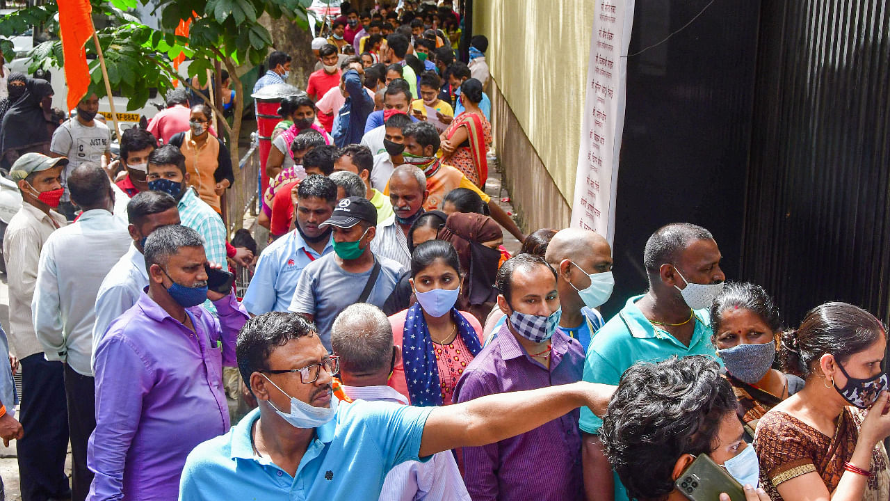 Beneficiaries wait to receive a dose of COVID-19 vaccine during mass vaccination drive organised by Shiv Sena in association with Reliance hospital, in Mumbai. Credit: PTI Photo