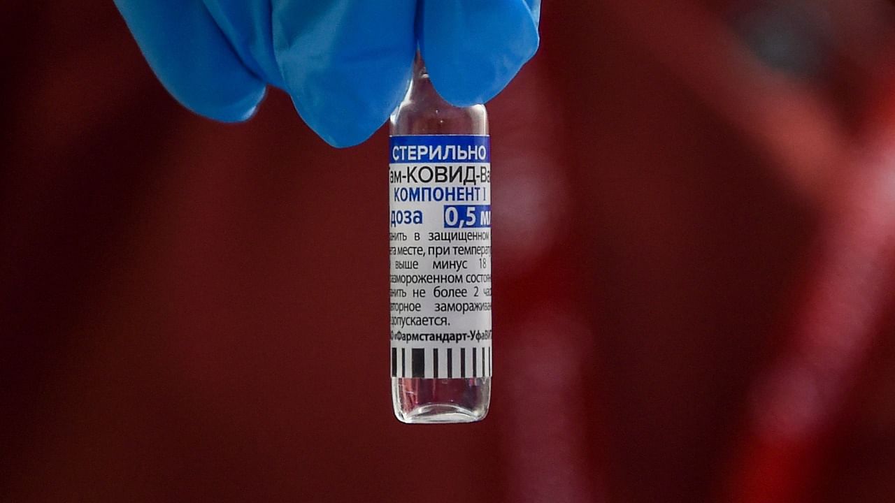 A health worker shows a vial of the Sputnik V vaccine. Credit: AFP Photo