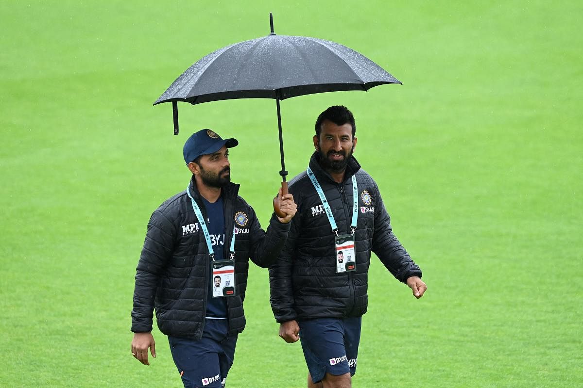 Ajinkya Rahane (left) and Cheteshwar Pujara, both with poor returns in England, need to step it up when the second Test kicks off at Lord's on Thursday. AFP 