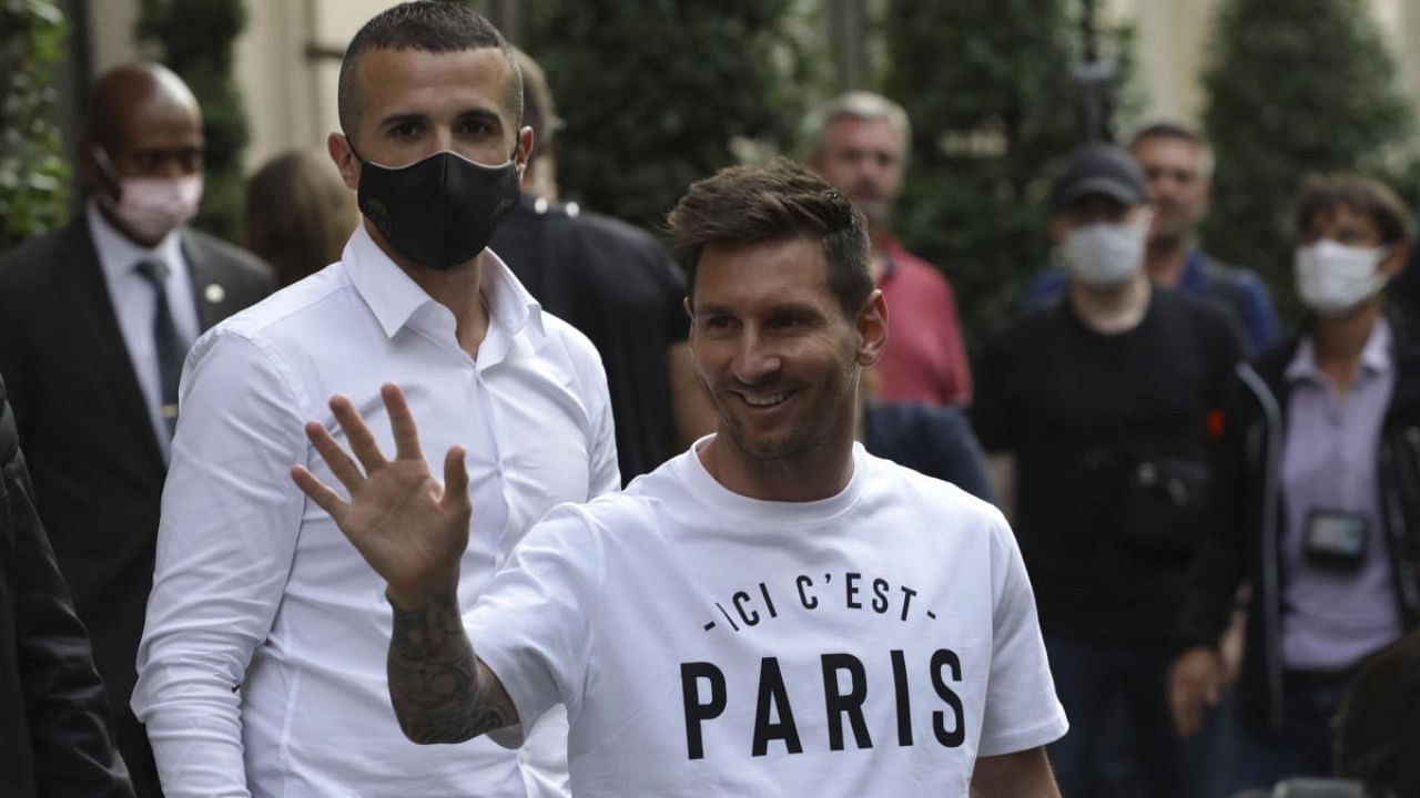 Argentinian soccer star Lionel Messi waves to supporters as he arrives at his hotel in Paris, Tuesday. Credit: AP/PTI Photo