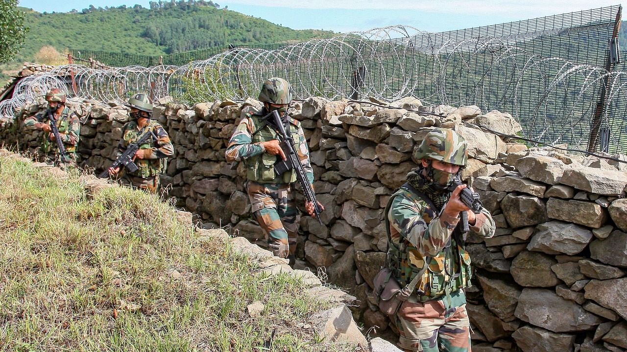 Indian Army soldiers patrol near Line of Control (LOC) at Bhimber Gali sector in Rajouri district. Credit: PTI Photo/Ministry of Defence