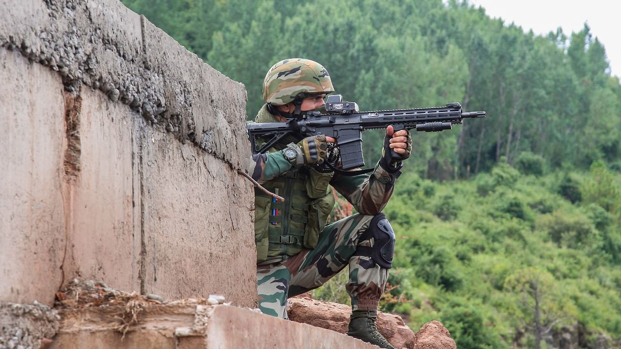 An Indian Army soldier keeps strict vigil near the Line of Control gate. Credit: PTI File Photo