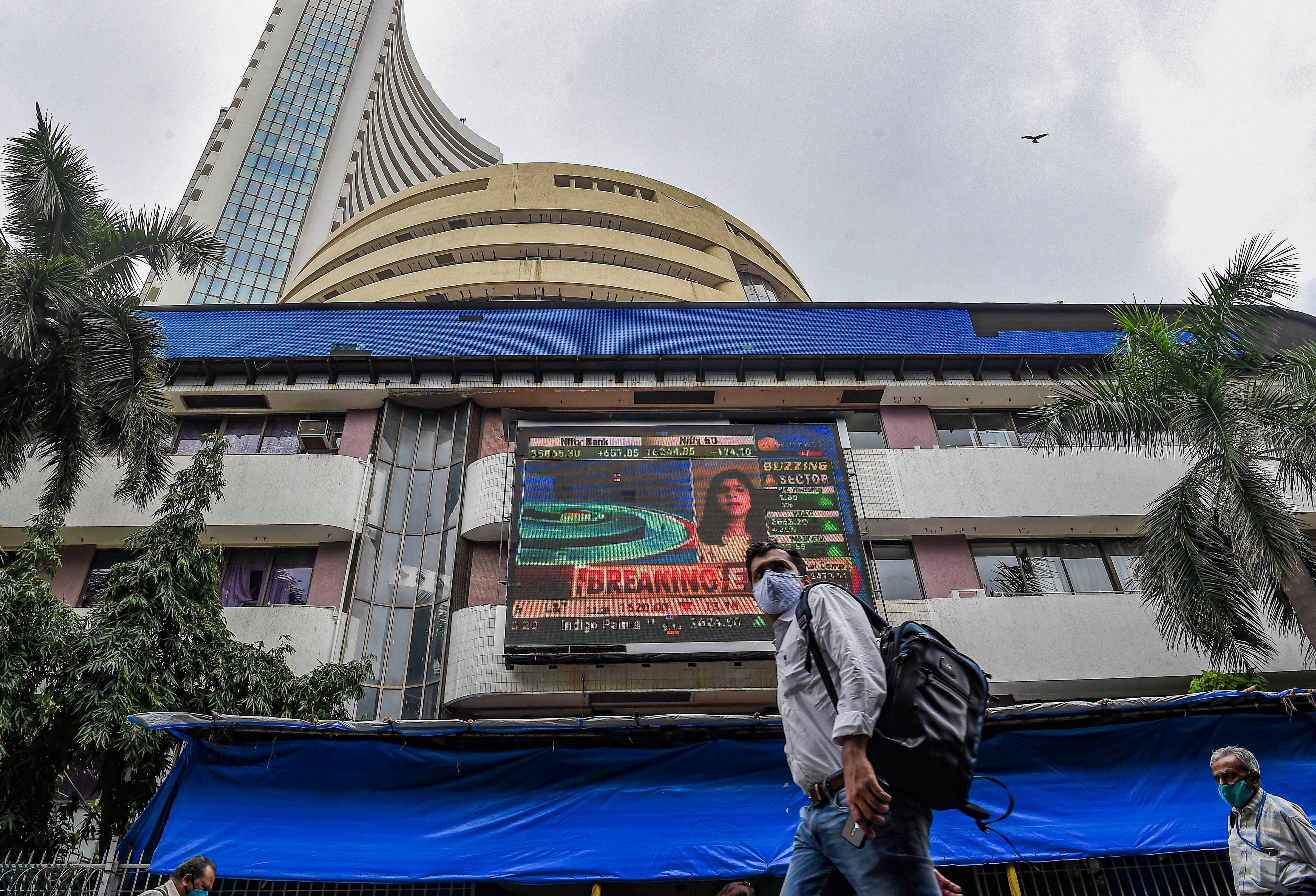 People walk past the Bombay Stock Exchange (BSE) building in Mumbai. Credit: PTI File Photo
