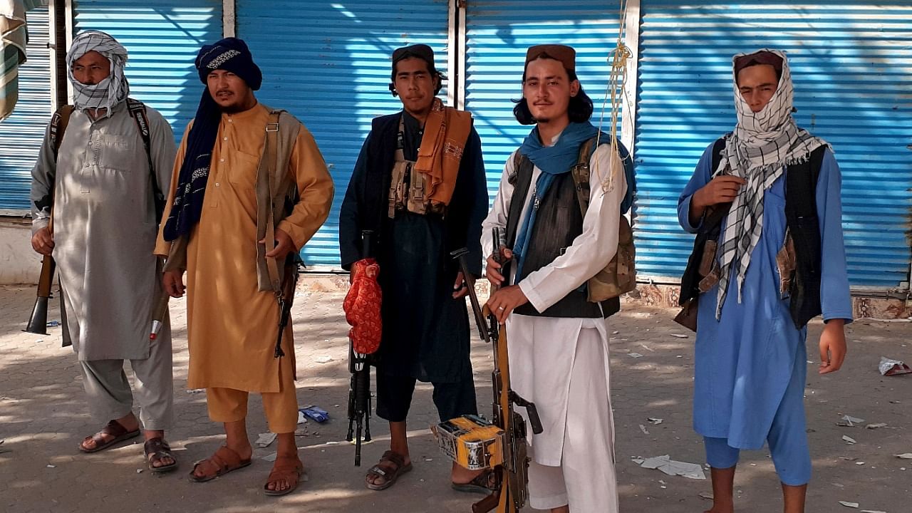 Taliban fighters stand guard in Kunduz city, northern Afghanistan. Credit: AP/PTI Photo