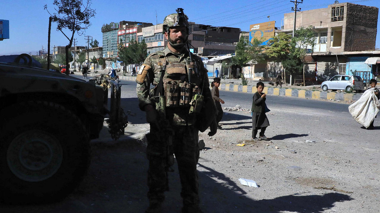 An Afghan security force personnel stands guard along the roadside in Herat on August 12. Credit: AFP Photo