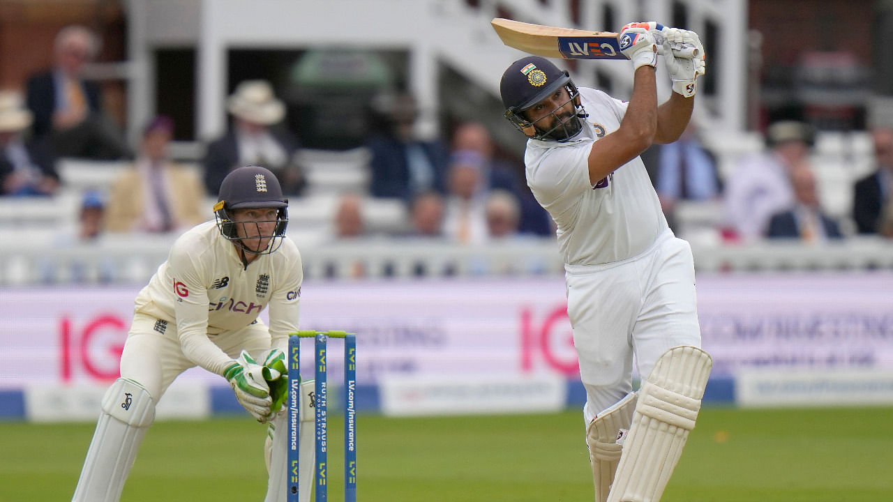 Rohit Sharma hits 4 runs off the bowling of England's Moeen Ali. Credit: AP Photo