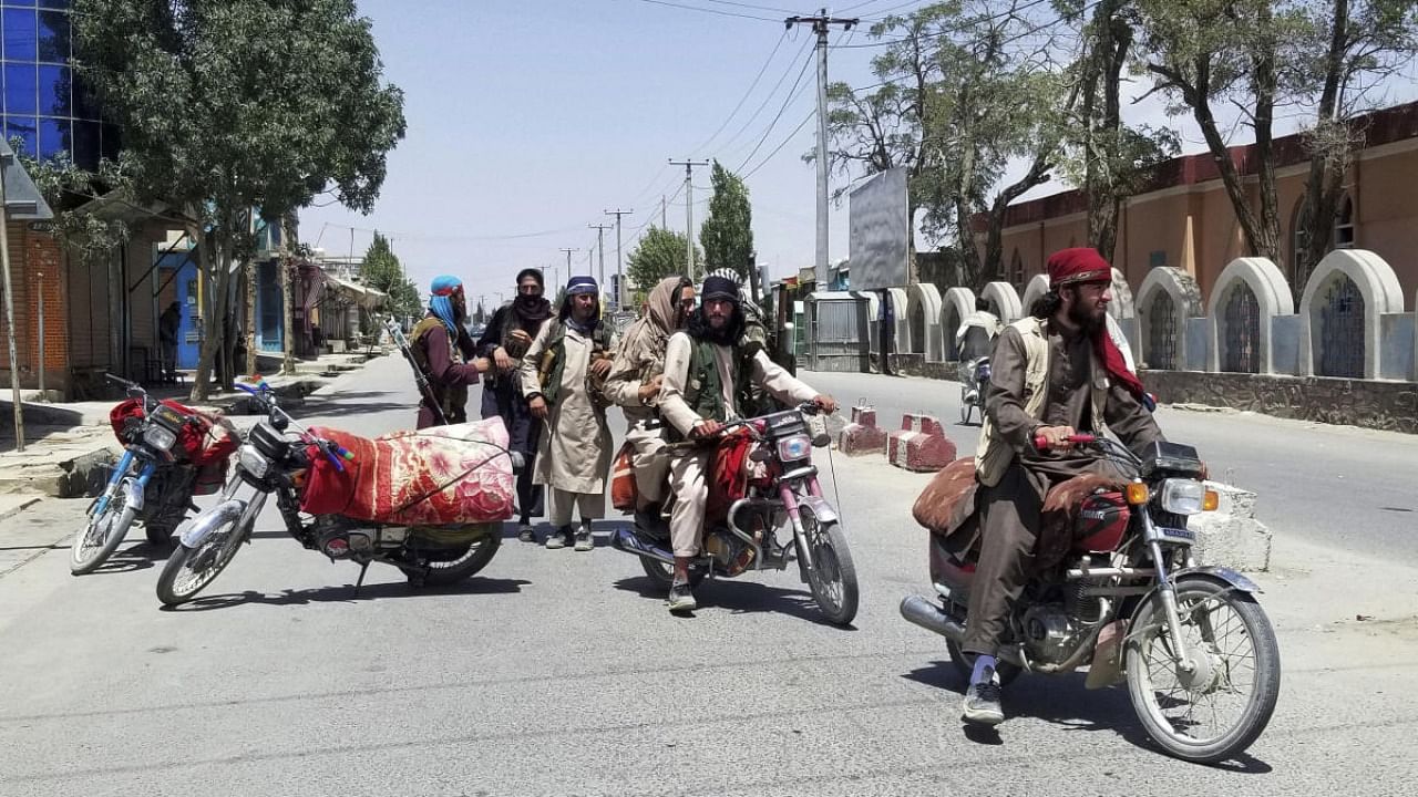 Taliban fighters patrol inside the city of Ghazni, southwest of Kabul, Afghanistan. Credit: AP Photo