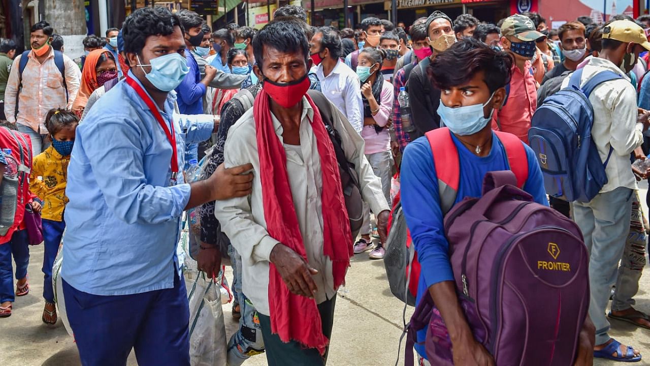 Passengers wait to undergo Covid-19 testing at a railway station in Bengaluru, Monday, August 9, 2021. Credit: PTI File Photo