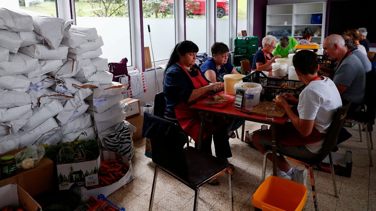 Volunteers prepare food for people affected by the floods after heavy rainfall in Jupille, Belgium. Credit: Reuters Photo