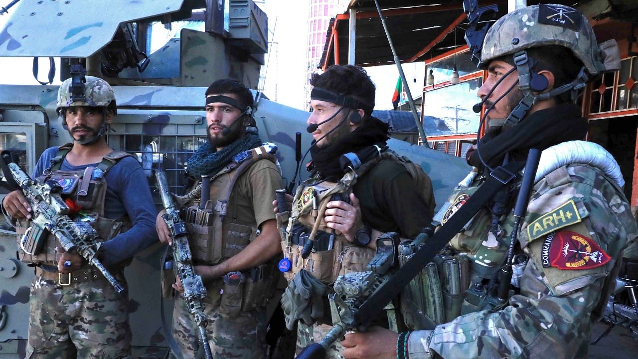 Afghan security force personnel stand guard. Credit: AFP Photo