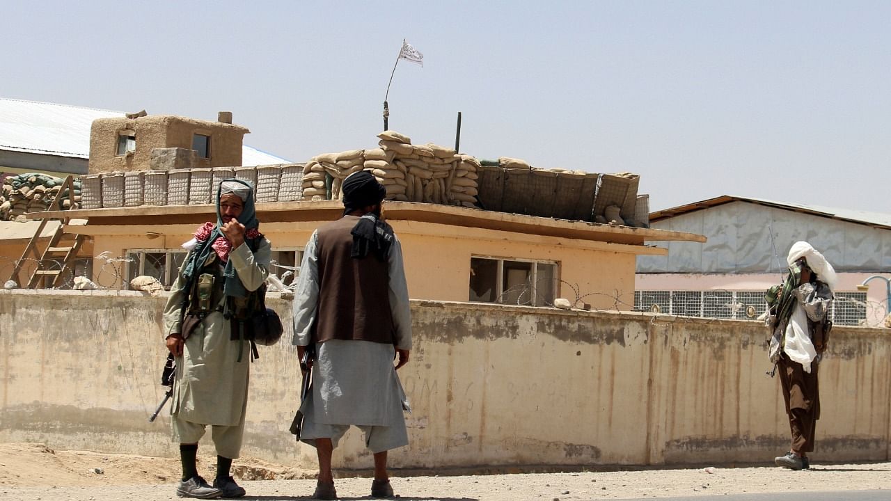 Taliban fighters stand guard inside the city of Ghazni, southwest of Kabul. Credit: AP Photo