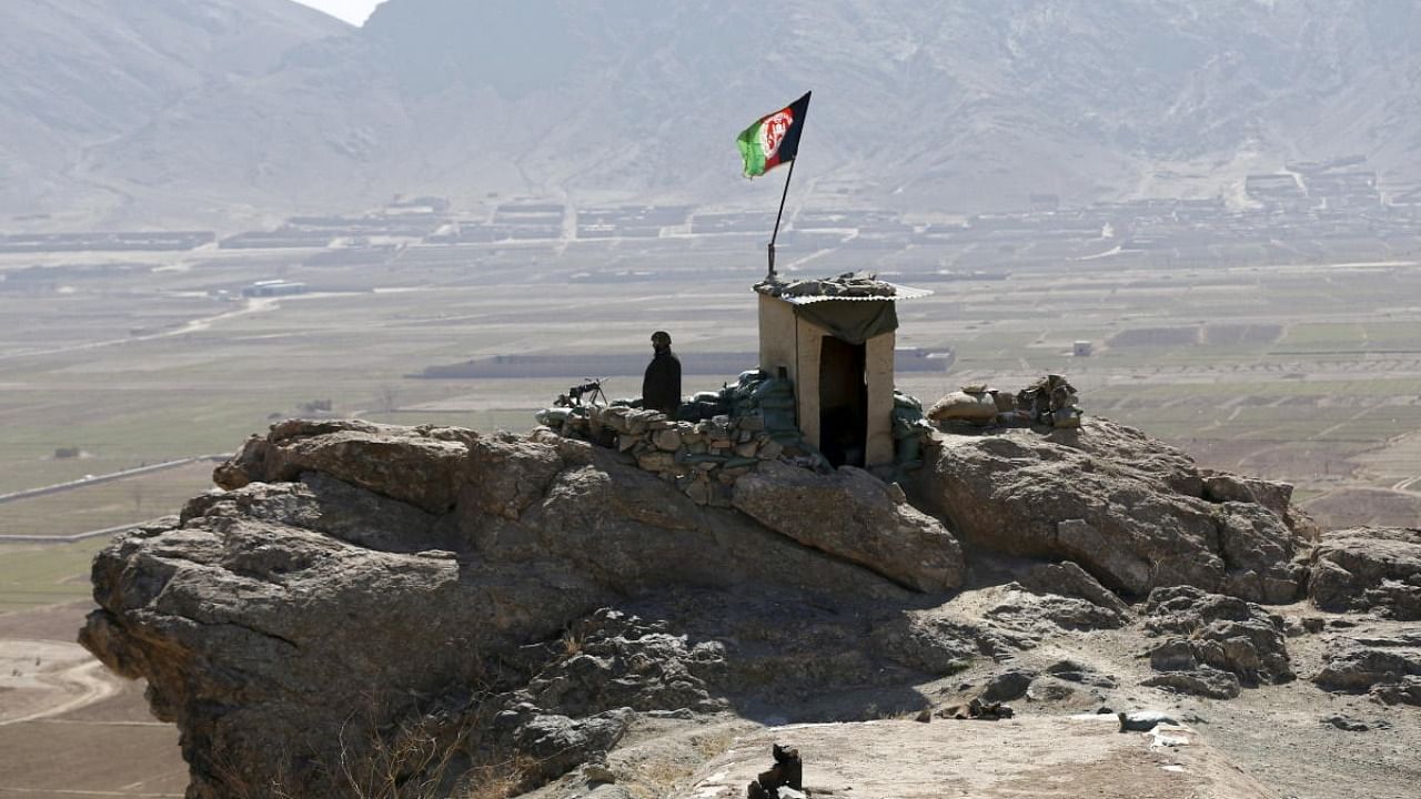 An ANA soldier keeps watch at a checkpost in Logar province, Afghanistan. Credit: Reuters Photo