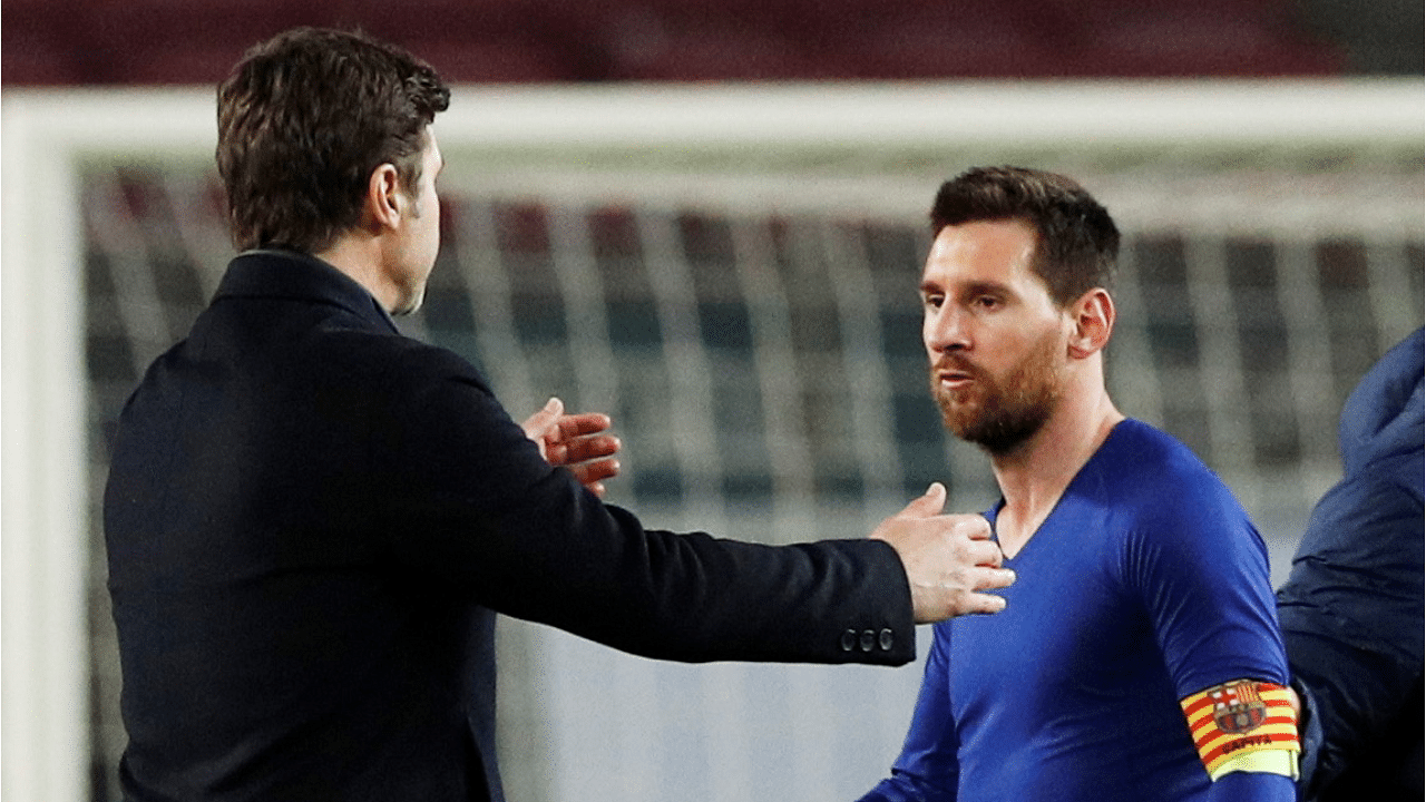 Lionel Messi with Paris St Germain coach Mauricio Pochettino. Credit: Reuters Photo