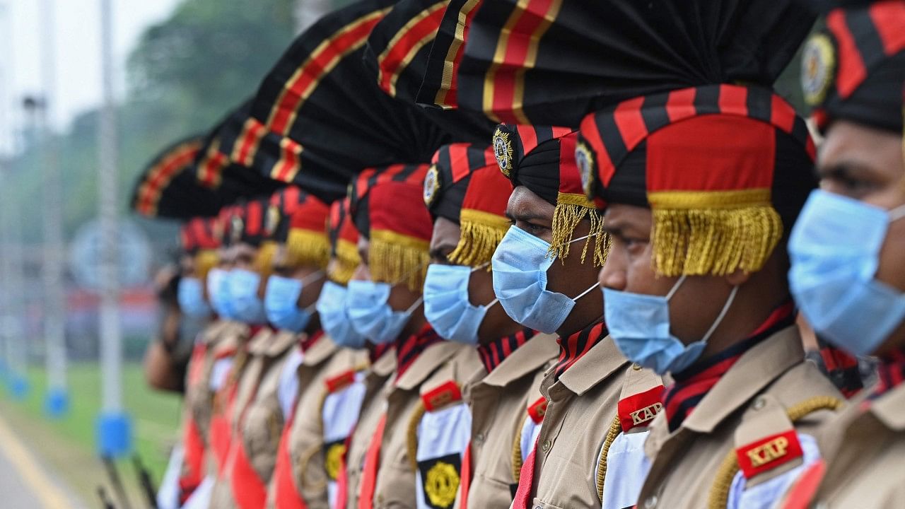 Kolkata Police personnel take part in the full dress rehearsal for India's Independence Day celebrations in Kolkata. Credit: AFP Photo