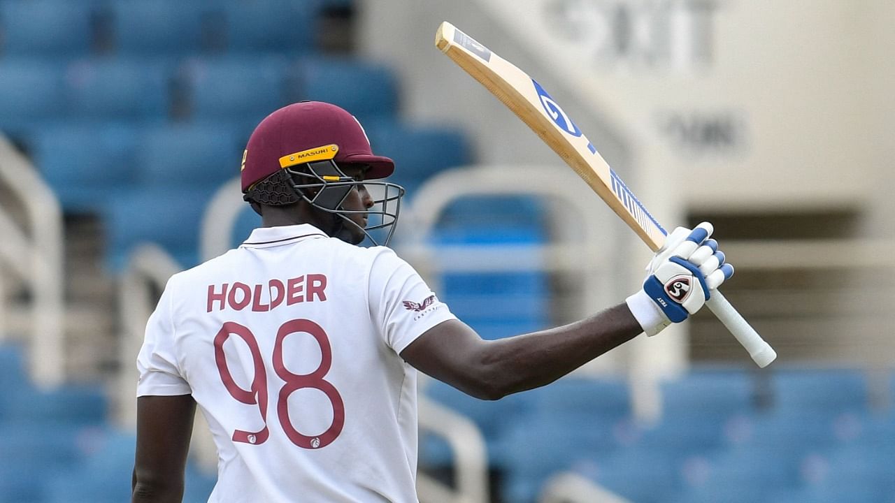 Jason Holder of West Indies celebrates his half century. Credut: AFP Photo