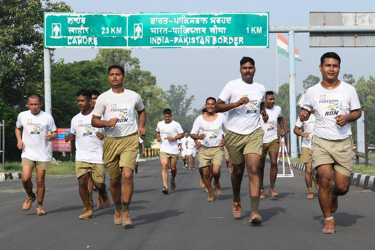 Indian Border Security Force (BSF) personnel take part in a "Fit India Freedom Run 2.0" to celebrate the 75th anniversary of India's Independence. Credit: AFP Photo