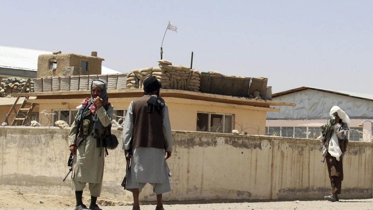 Taliban fighters stand guard inside the city of Ghazni. Credit: AP Photo