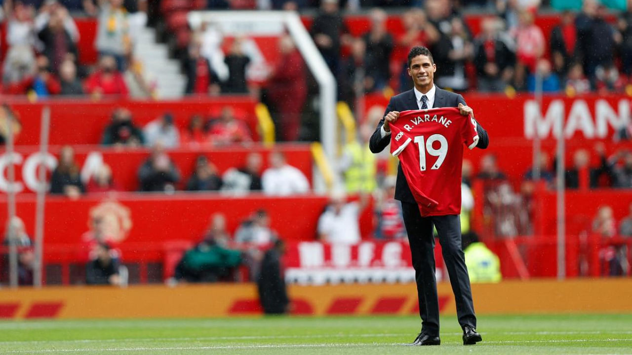 Manchester United's Raphael Varane is presented to the fans ahead of the English Premier League football match between Manchester United and Leeds United at Old Trafford. Credit: AFP Photo