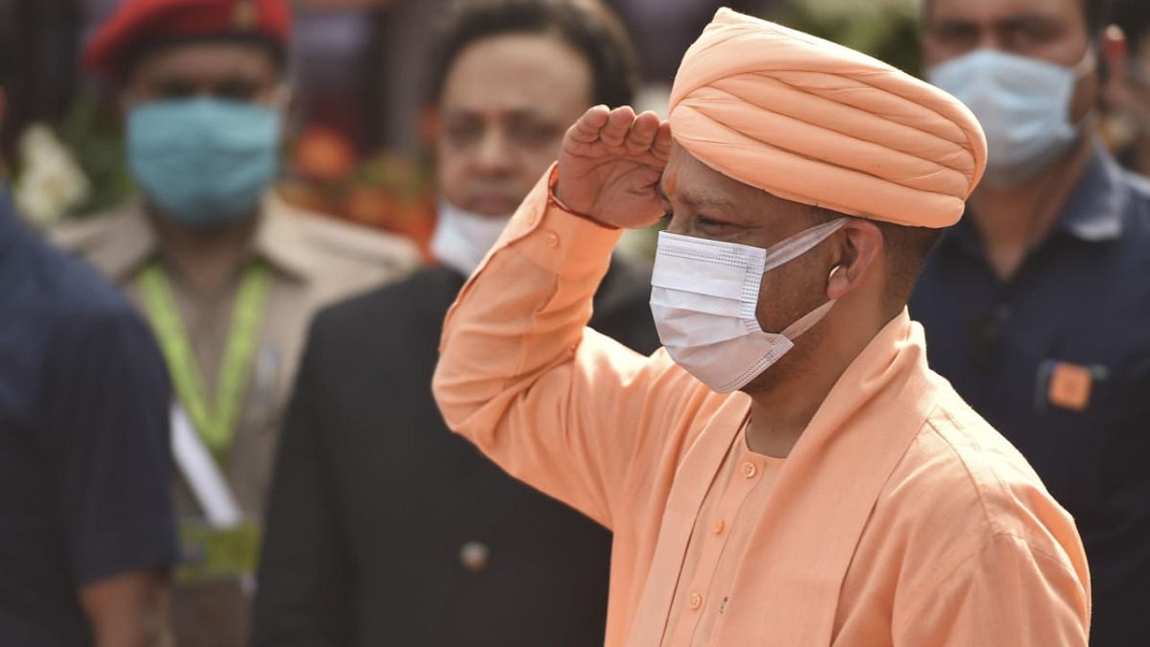 Uttar Pradesh Chief Minister Yogi Adityanath hoists the Tricolor during the 75th Independence Day celebrations at Vidhan Bhawan in Lucknow, Sunday, August 15, 2021. Credit: PTI Photo