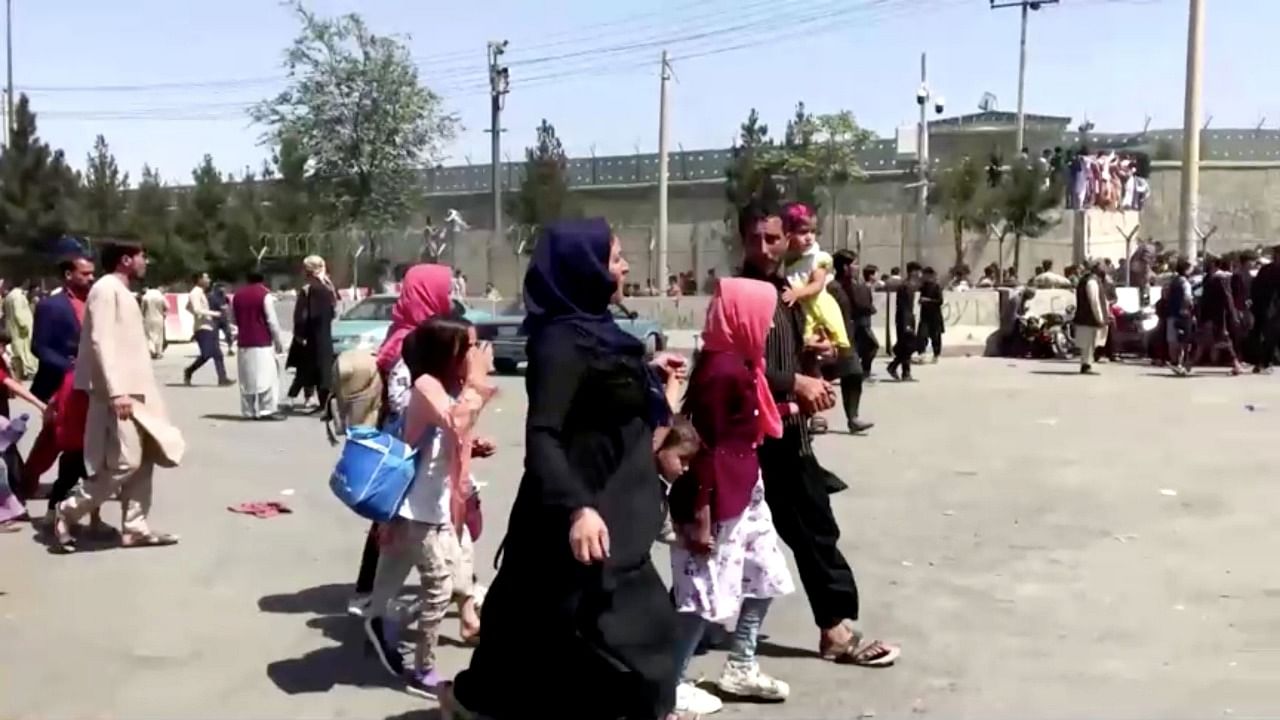 People gather outside Kabul airport. Credit: Reuters Photo