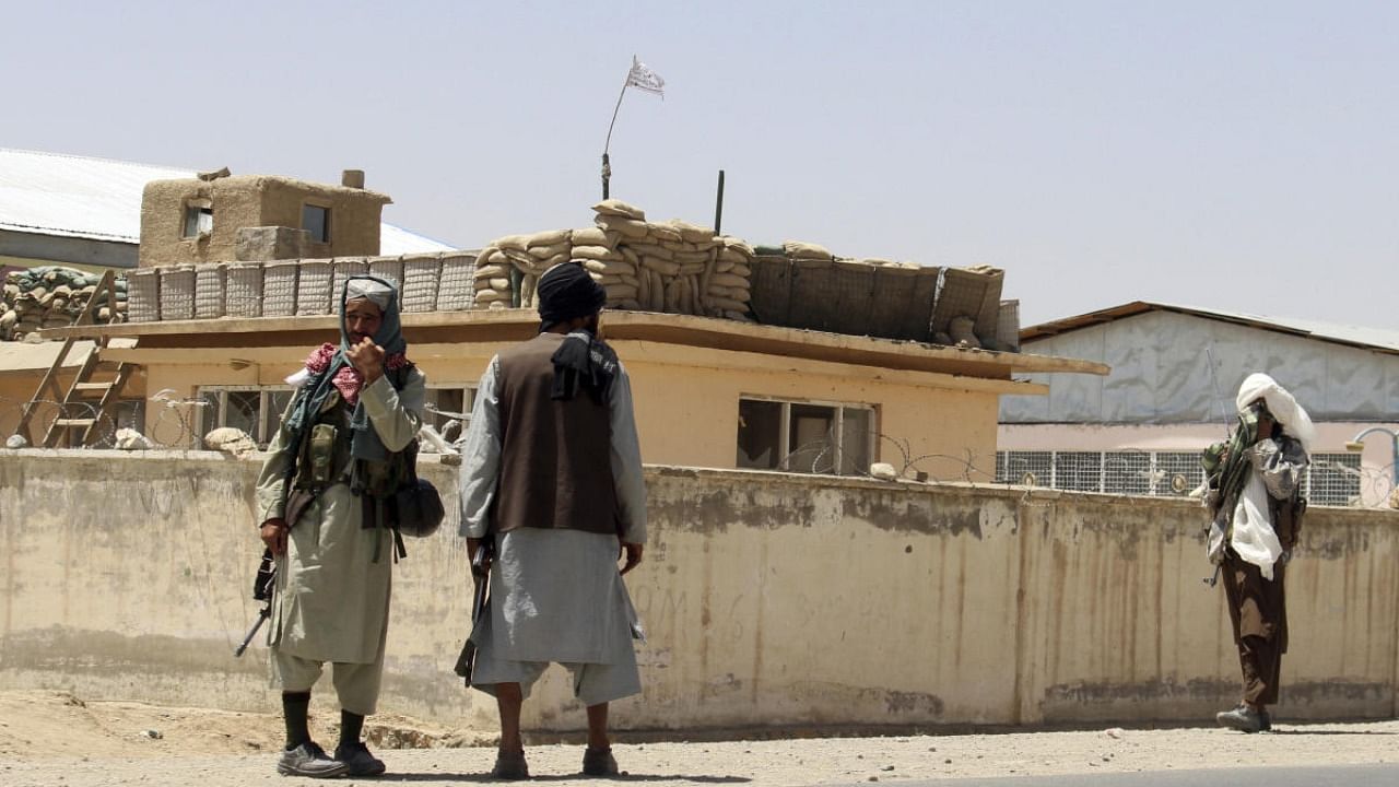 Taliban fighters stand guard inside the city of Ghazni, southwest of Kabul, Afghanistan. Credit: AP Photo