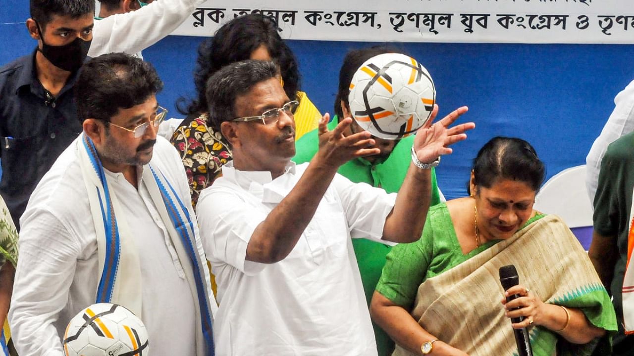 West Bengal Transport & Housing Minister Firhad Hakim plays with a football during 'Khela Hobe Diwas', in Kolkata. Credit: PTI Photo